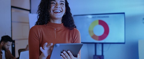 Smiling woman doing presentation from iPad